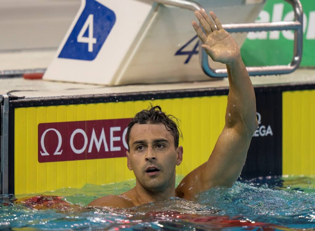 Dylan Carter of Trinidad and Tobago waves after winning the men's 50m freestyle at the FINA Swimming World Cup meet in Toronto, on October 28. (via AP) - 