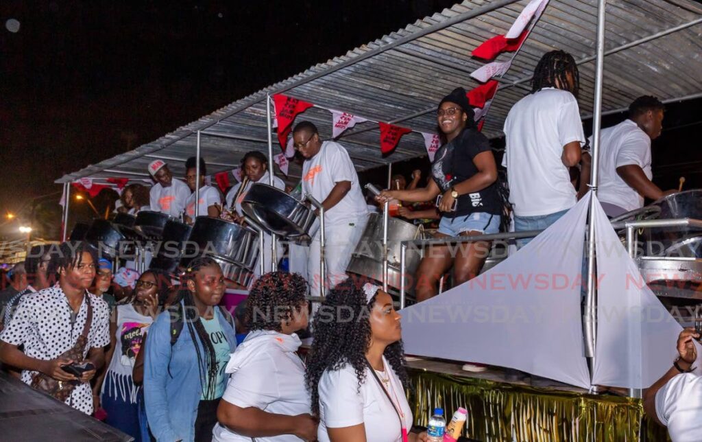 Pan lovers jam to the music of KatzenJammers Steel Orchestra, during Pan Trinbago's Pan and Powder event, in Scarborough, last Saturday. Photo by David Reid