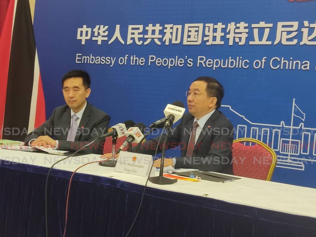 Chinese ambassador to TT Fang Qiu, right, responds to a question during a media briefing at the Chinese Embassy, Long Circular Road, St James, on Wednesday morning as counsellor Lichun Zhou looks on.  - Shane Superville