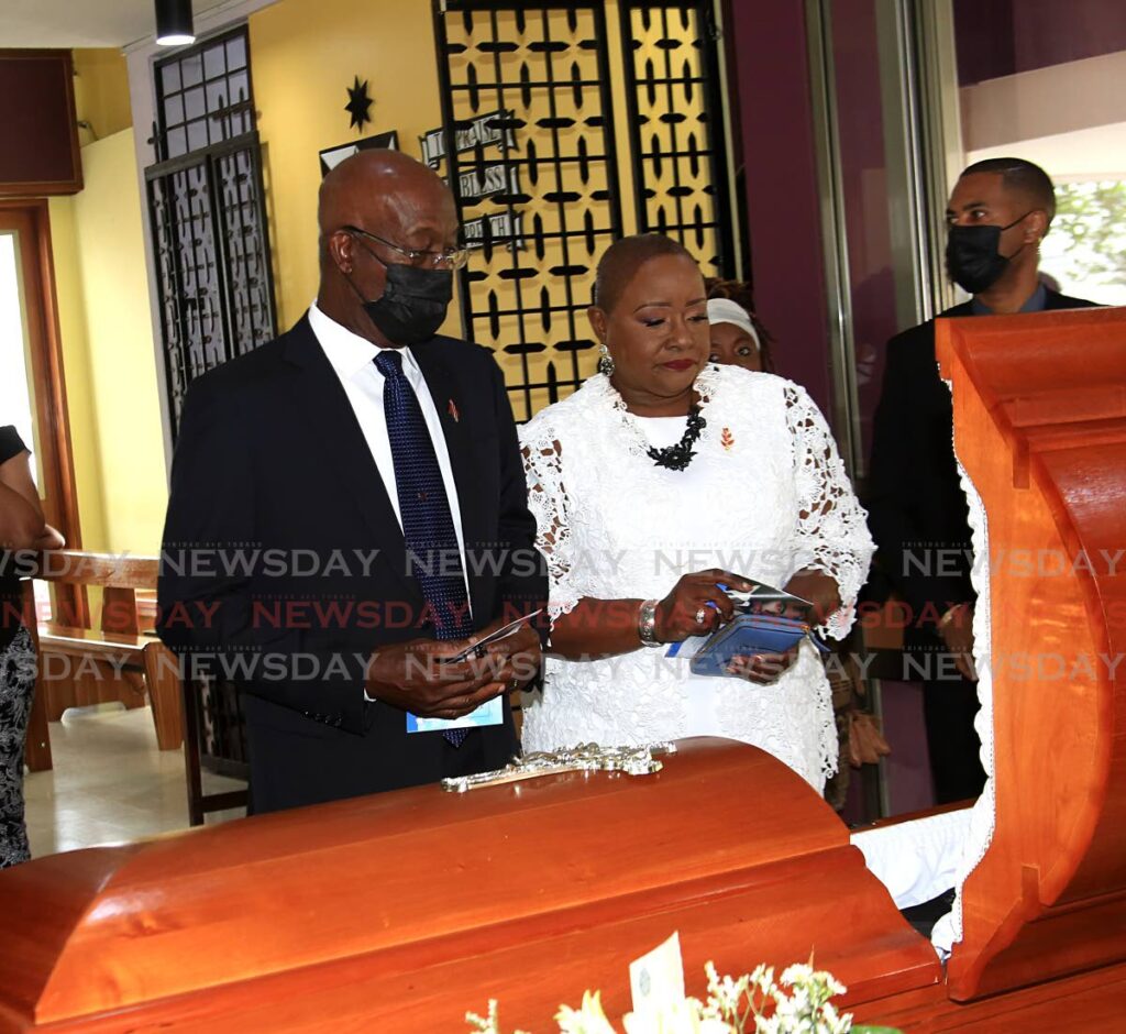 Prime Minister Dr Keith Rowley and Housing Minister Camille Robinson-Regis pay their respects at the funeral service of the late Dr Lester Henry at St Finbar’s RC Church in Diego Martin on Wednesday. Photo by Sureash Cholai