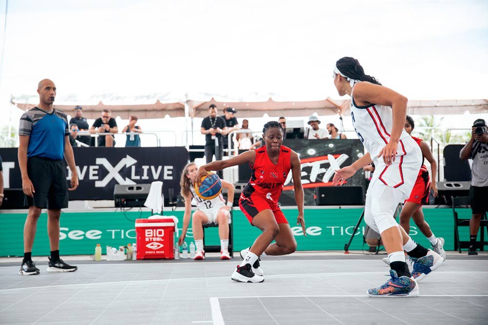 Nikiya Baptiste puts the moves on her defender in TT's match versus USA at the 2021 FIBA 3x3 AmeriCup. 