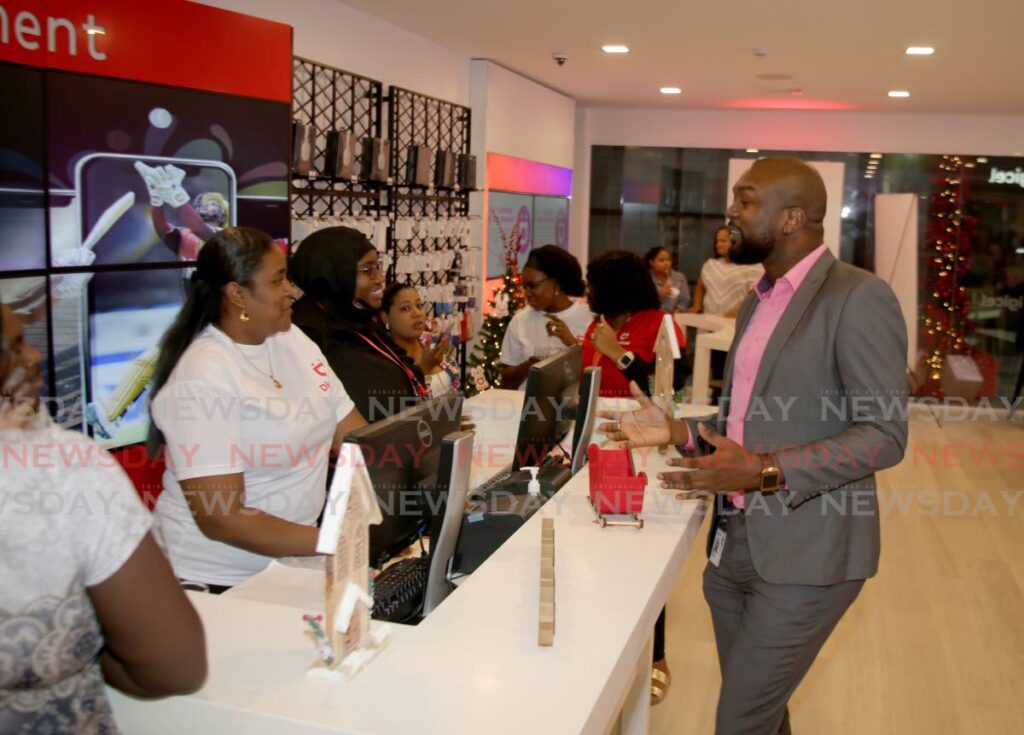 Colin Greaves, Digicel head of public relations, speaks with staff at the launch of Digicel’s flagship store on the second floor of  Excellent City Centre, Lower Frederick Street , Port of Spain on Thursday evening. - SUREASH CHOLAI