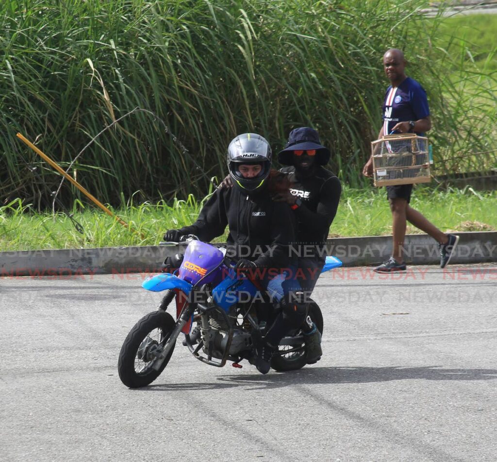 A student takes instructor Johann Andrews for a ride. - ANGELO MARCELLE