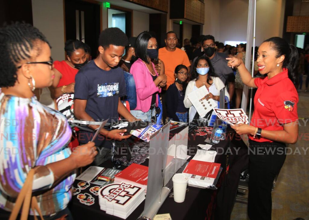 People get info about Barry University, of Florida at the College Fair at Hyatt Regency Hotel, Port of Spain on Saturday. - Angelo Marcelle