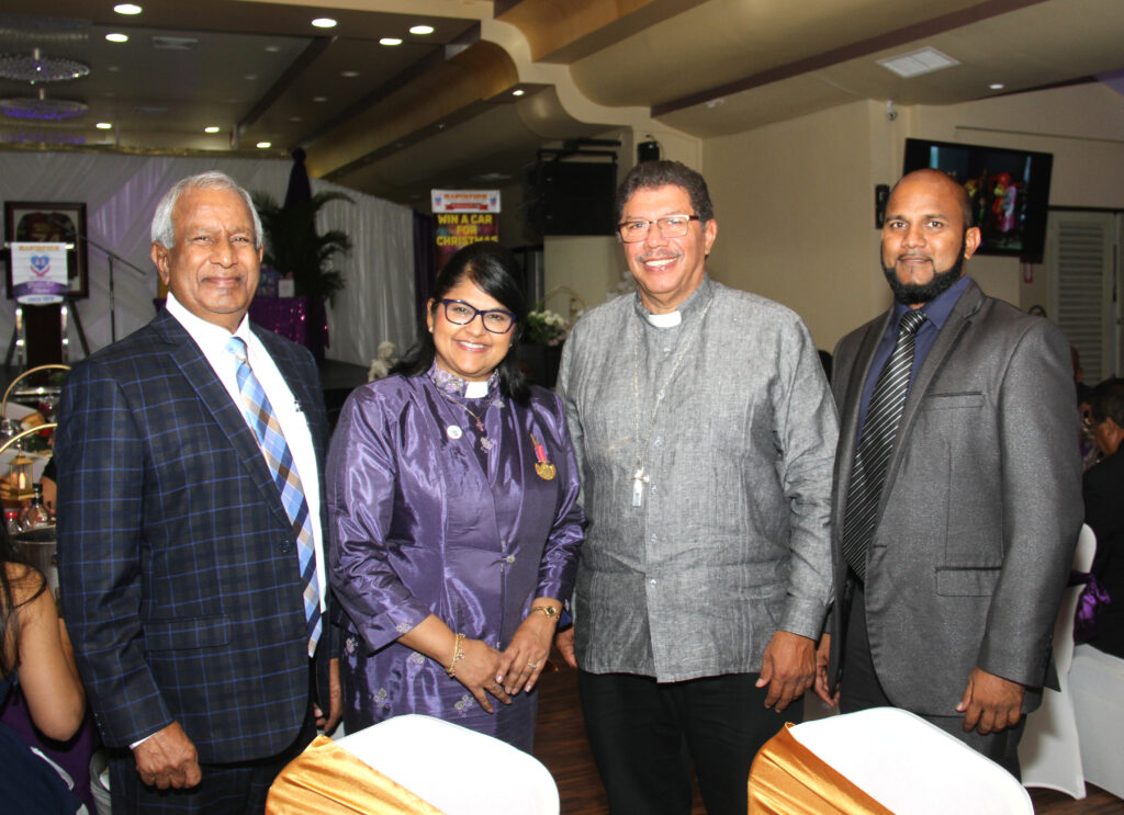 From left, Apostle Carlyle Chakersingh of the Faith Centre, Moderator of the Presbyterian Church Rev Joy Abdul-Mohan, Roman Catholic Archbishop Charles Jason Gordon, and Barry Rampersad of the Faith Centre smile for a photo at the Rapidfire Kidz Foundation gala at Acheivors Banquet Hall, Duncan Village, San Fernando. - Photo by Ayanna Kinsale