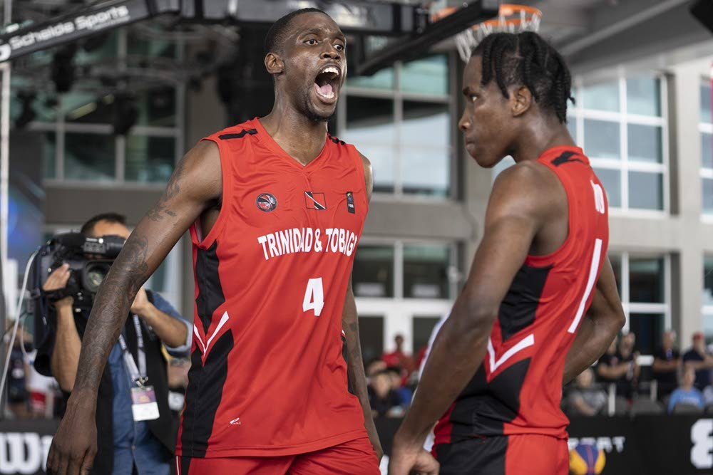 TT's Moriba DeFreitas (4) and Ahkeel Boyd (1) engage the crowd after Boyd made a basket and drew a foul on route to TT's victory over the Dominican Republic in their quarter-final clash at the FIBA 3x3 AmeriCup over the weekend. - 