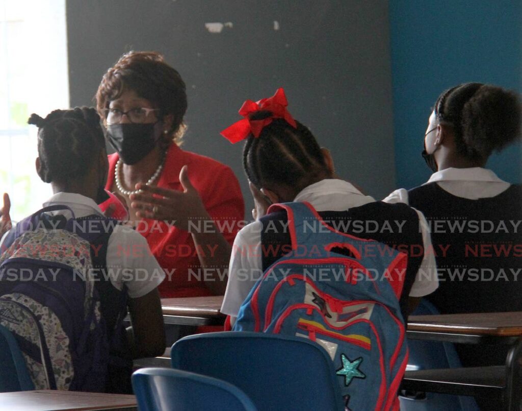 Rose Hill RC principal Sharlene Quamina speaks with students on their return to school on Wednesday. - AYANNA KINSALE