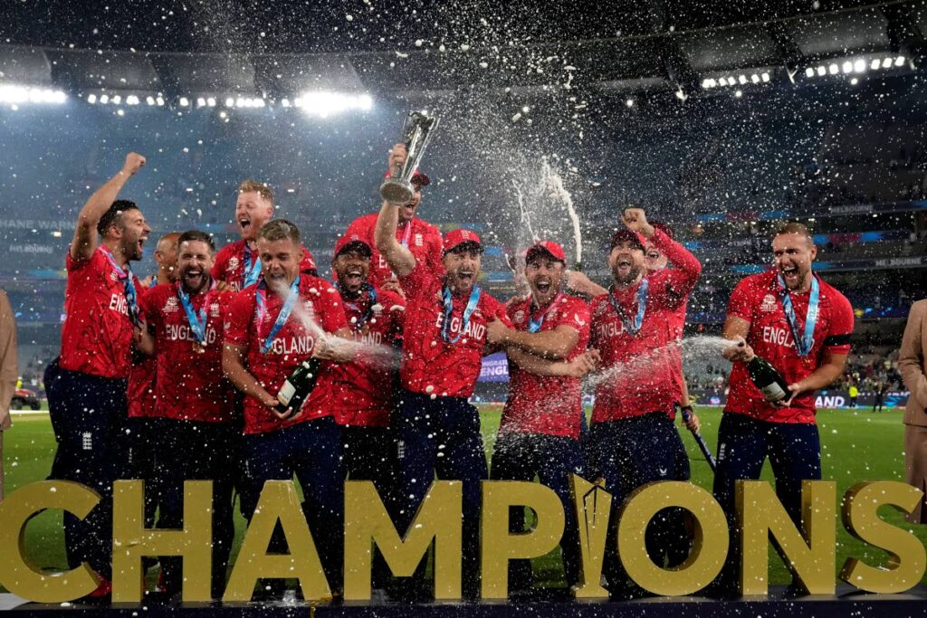 England players celebrate with the winners trophy after beating Pakistan in the final of the T20 World Cup at the Melbourne Cricket Ground in Melbourne, Australia, on Sunday. (AP Photo) 