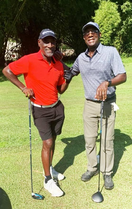 TEE TIME: Prime Minister Dr Keith Rowley posted this photo on his Facebook page on Saturday showing himself with retired WI cricket legend Viv Richards on the golf course.  - Facebook