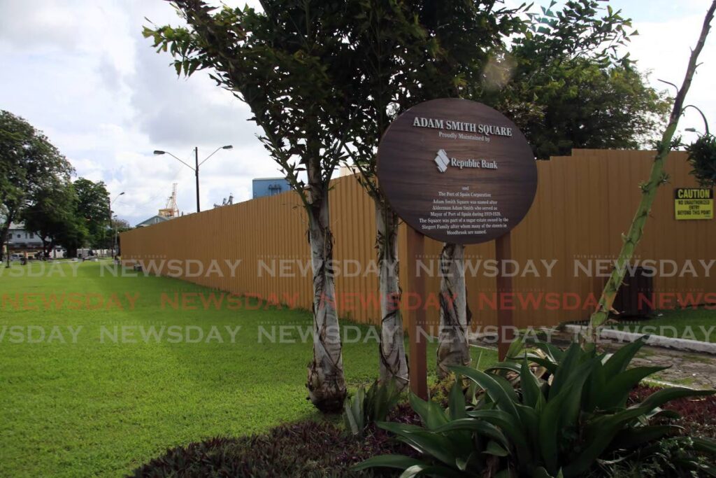 A galvanised fence has been constructed at the site of a proposed police post at Adam Smith Square, Woodbrook. The site is now being used as a site office for sidewalk refurbishment works. - SUREASH CHOLAI