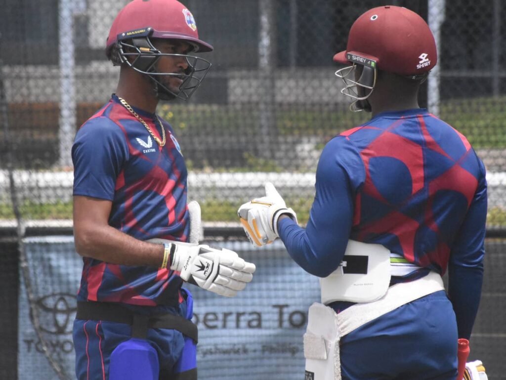 West Indies captain Kraigg Brathwaite (L) speaks with teammate Nkrumah Bonner during a team training session in Canberra, Australia on Monday. Photo by CWI Media