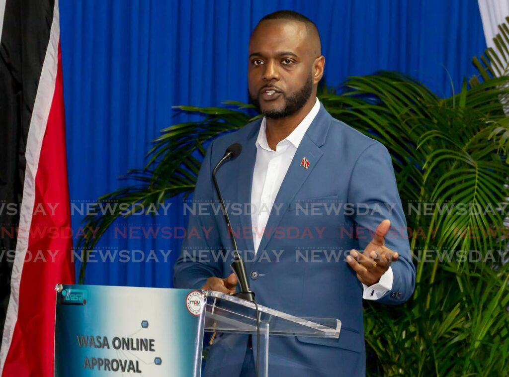 Public Utilities Minister Marvin Gonzales at the launch of the WASA online approval system at T&TEC Sports Club in Scarborough on Tuesday. - Photo by David Reid
