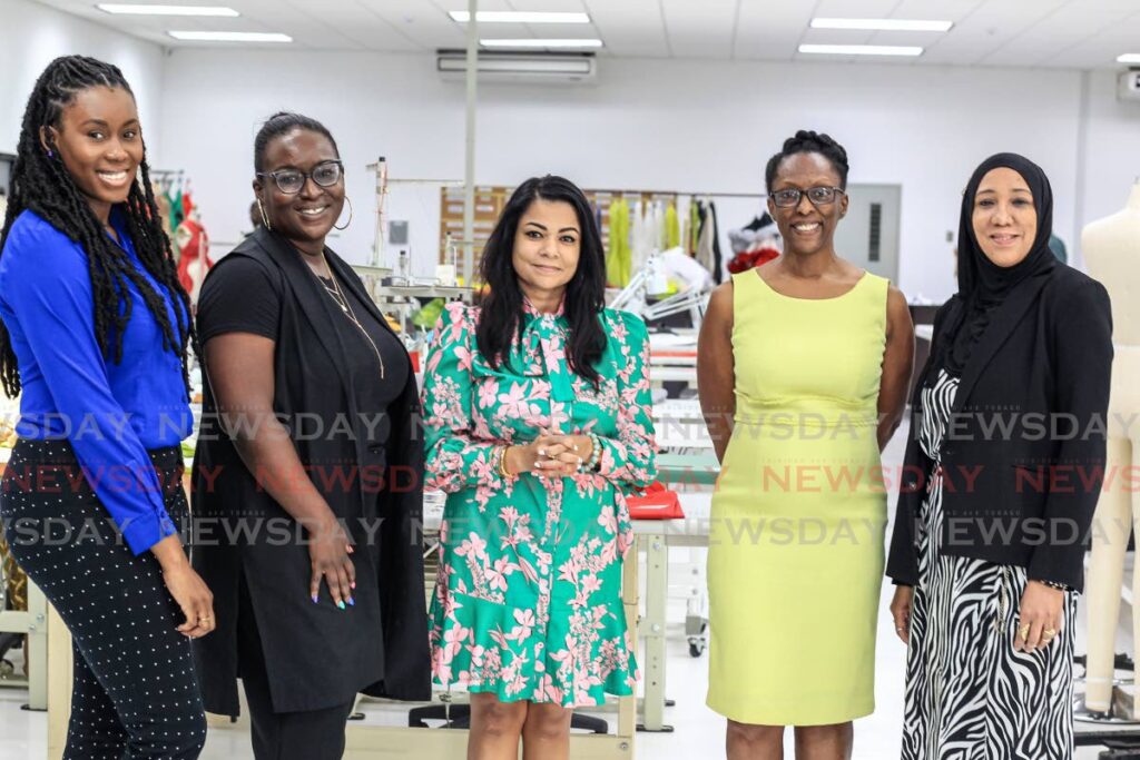 Fashion TT general manager Lisa-Marie Daniel, centre, with the Made868 team, from left, project manager Raenelle Simmons, project lead Aisha Stewart, manager Anna White and supervisor Sandra Carr at the Made868 facility, John S Donaldson, UTT campus, Port of Spain. Photo by Roger Jacob