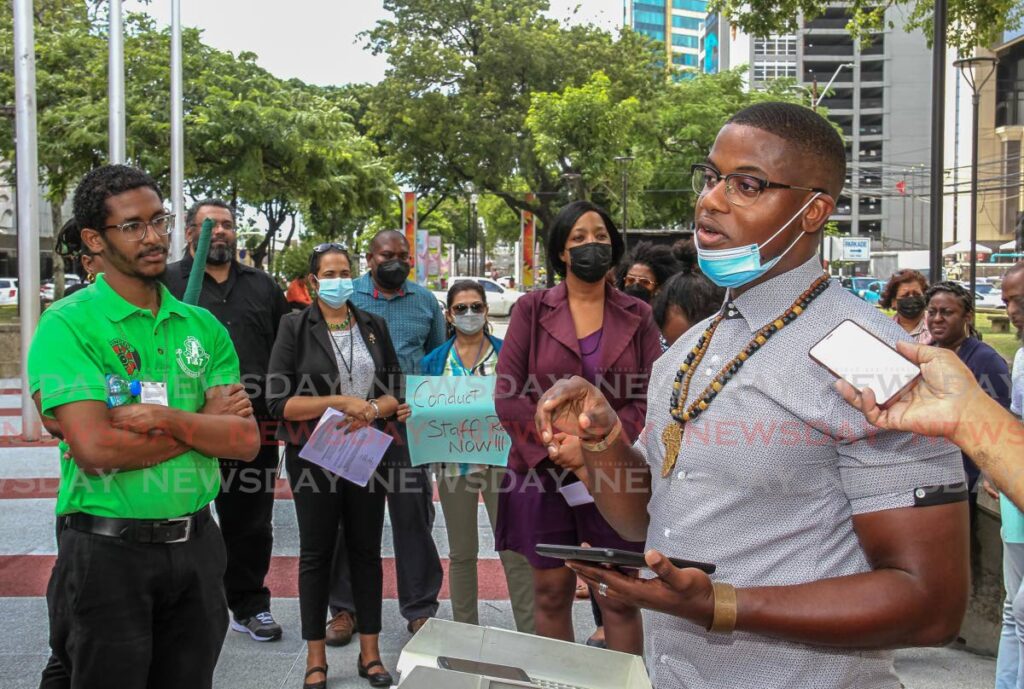 PSA industrial court staff representative Duaine Hewitt speaks to the media as he leads a protest on Independence Square, Port of Spain on Wednesday. Hewitt is making a plea for more information on contract positions in the public service.  Photo by Ayanna Kinsale