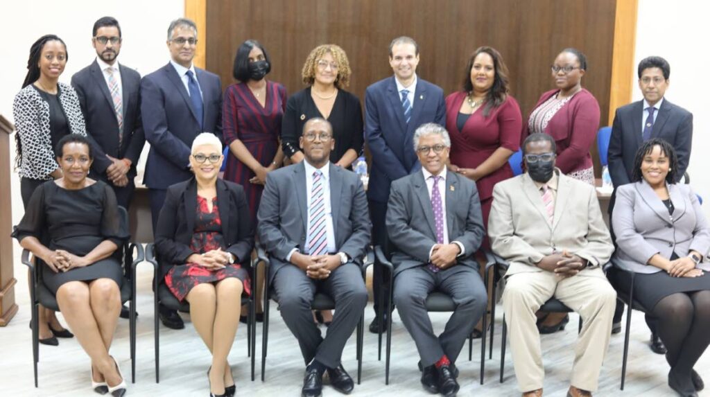 Newly-appointed members of the Mediation Board with Chief Justice Ivor Archie and Attorney General Reginald Armour (seated, third and fourth from left). - 