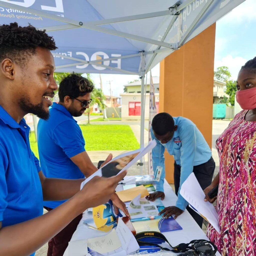 Members of the Equal Opportunities Commission caravan talk to the public about their rights, during an outreach programme in Roxborough last week. PHOTO COURTESY EOC - 