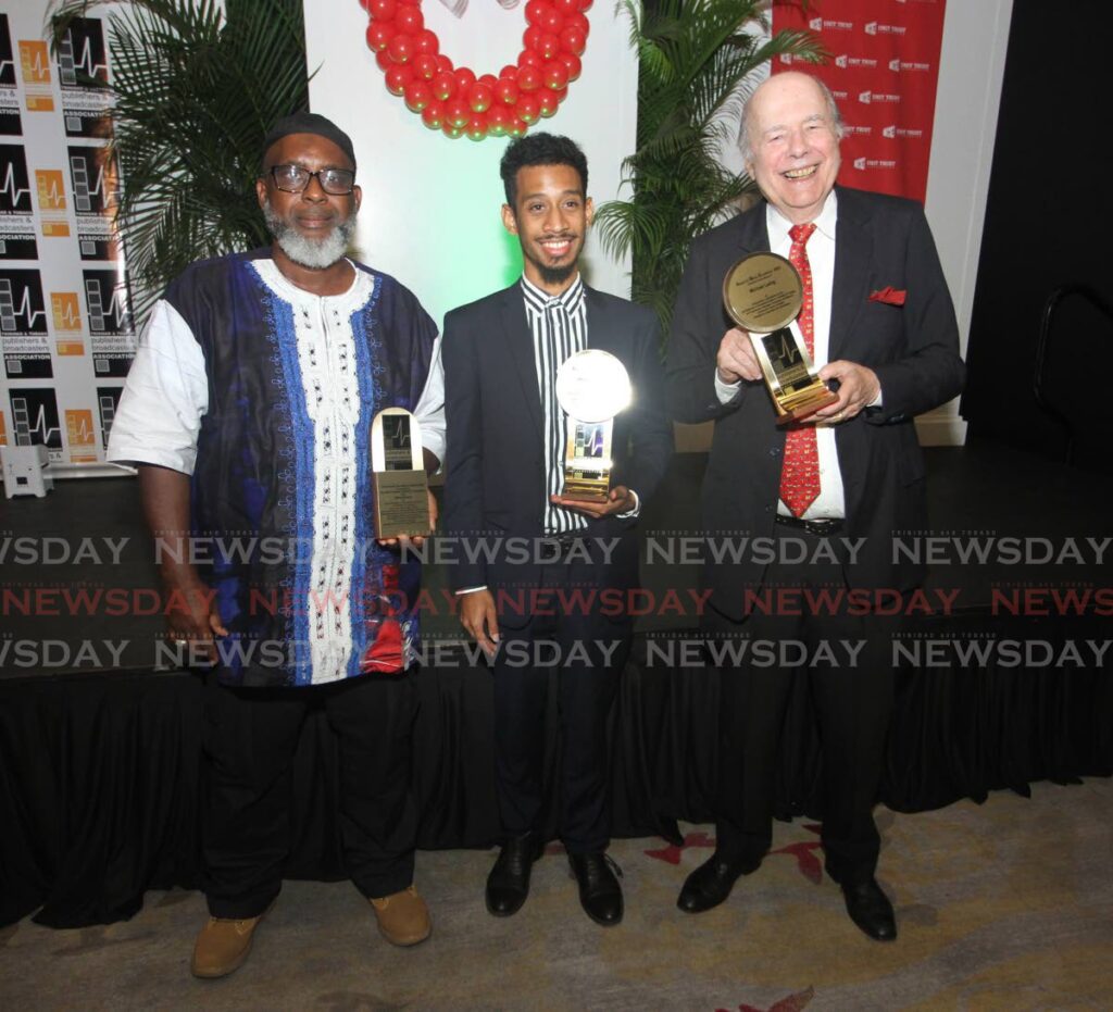 From left, ROOTS Foundation founder Mtima Solwazi,  Mikhail Gibbings collecting on behalf of his father Wesley Gibbings and TTPBA Director Peter Ames, collecting on behalf of Michael Laing (deceased), stand with awards presented to them at the TTPBA’s 16th annual dinner & awards ceremony at the Hyatt, Port of Spain on Tuesday. - Photo by Angelo Marcelle