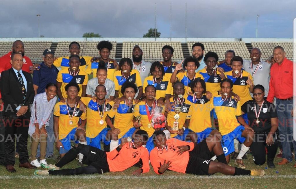Trinity East College players and officials celebrate after the team beat San Juan North Secondary, on Wednesday, in the Tiger Tanks/Coca Cola Intercol East Zone final, at the Larry Gomes Stadium, Malabar.  - ROGER JACOB 