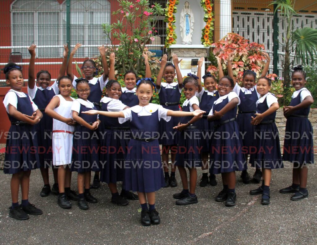 St Charles (Tunapuna) Girls' RC School parranderas celebrate with award-winning lead singer Leigha Thomas at their school, Eastern Main Road, Tunapuna. - AYANNA KINSALE