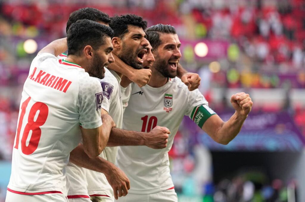 Iran's players celebrate after defeating Wales in a World Cup group B match, at the Ahmad Bin Ali Stadium in Al Rayyan , Qatar, Friday. - AP Photo