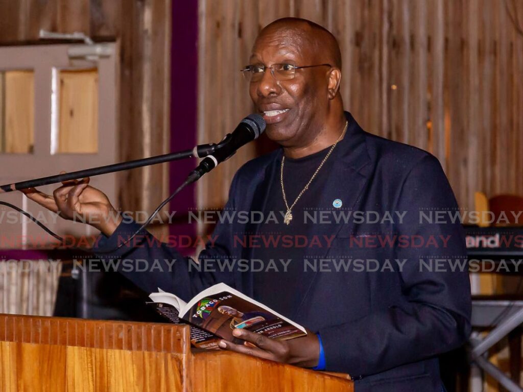 John Arnold gives remarks and reads from his newly-launched memoir John Arnold: A Tobago Son at Kariwak Village Hotel, Crown Point. - David Reid
