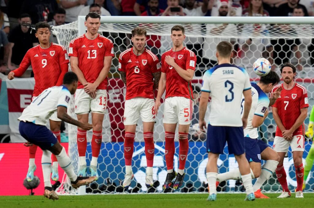 England's Marcus Rashford, front left, scores his side's opening goal during the World Cup group B match against Wales, at the Ahmad Bin Ali Stadium in Al Rayyan, Qatar, on Tuesday. - AP Photo