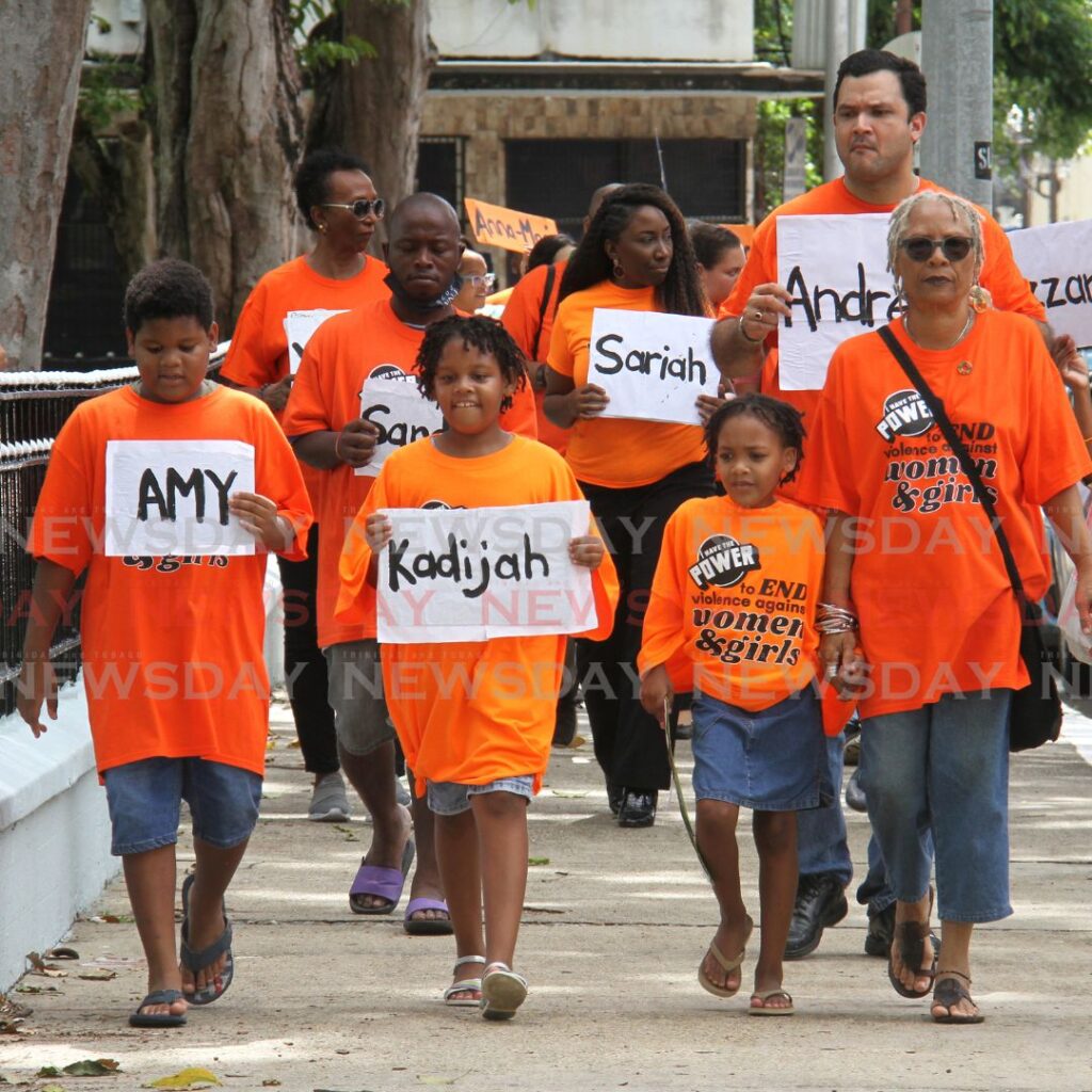 Participants make their way around Memorial Park, Frederick Street, Port of Spain during the We Remember march in remembrance of women and girls who lost their lives to gender-based violence. Photo by Ayanna Kinsale