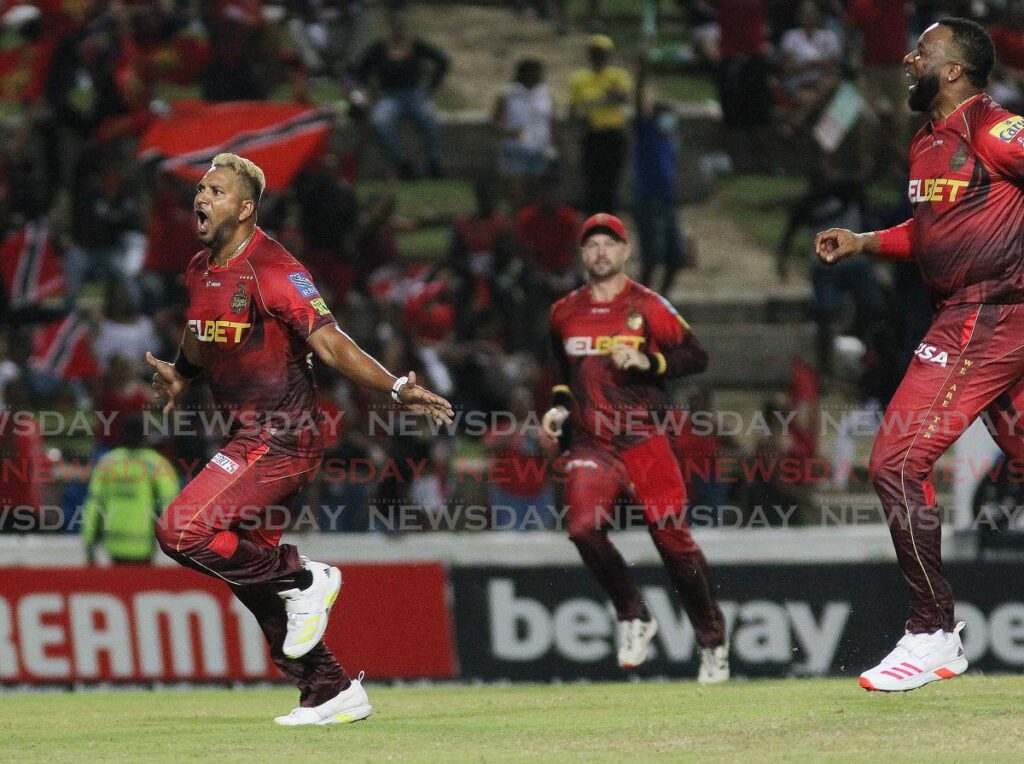 Trinbago Knight Riders bowler Ravi Rampaul, left, celebrates a wicket in the Hero CPL 2022. FILE PHOTO/LINCOLN HOLDER - 