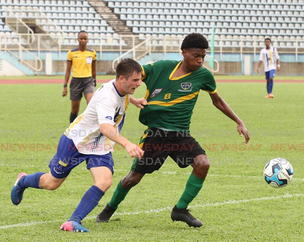 Fatima College’s Jesse Hospedales  (L) and St Benedict’s Derrel Garcia vie for control of the ball during the Secondary Schools Football League Premiership division final, on October26, at the Ato Boldon Stadium, Couva.  - Marvin Hamilton