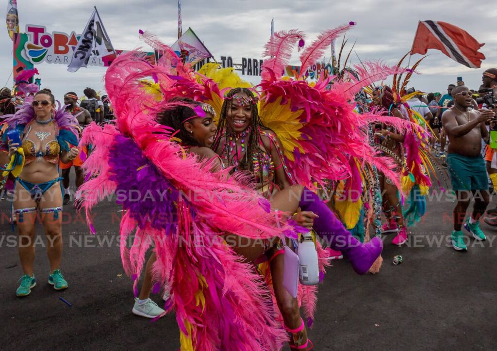 Arcadia Mas Band revellers enjoy themselves on the Rockly Bay stage during the parade of the bands on Milford Road, Scarborough, Tobago. File photo/David Reid  