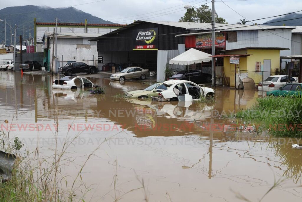 A used-car dealership flooded out in Bamboo No 3, Valsayn after torrential rain on Saturday. PHOTO BY JEFF K MAYERS - JEFF K MAYERS