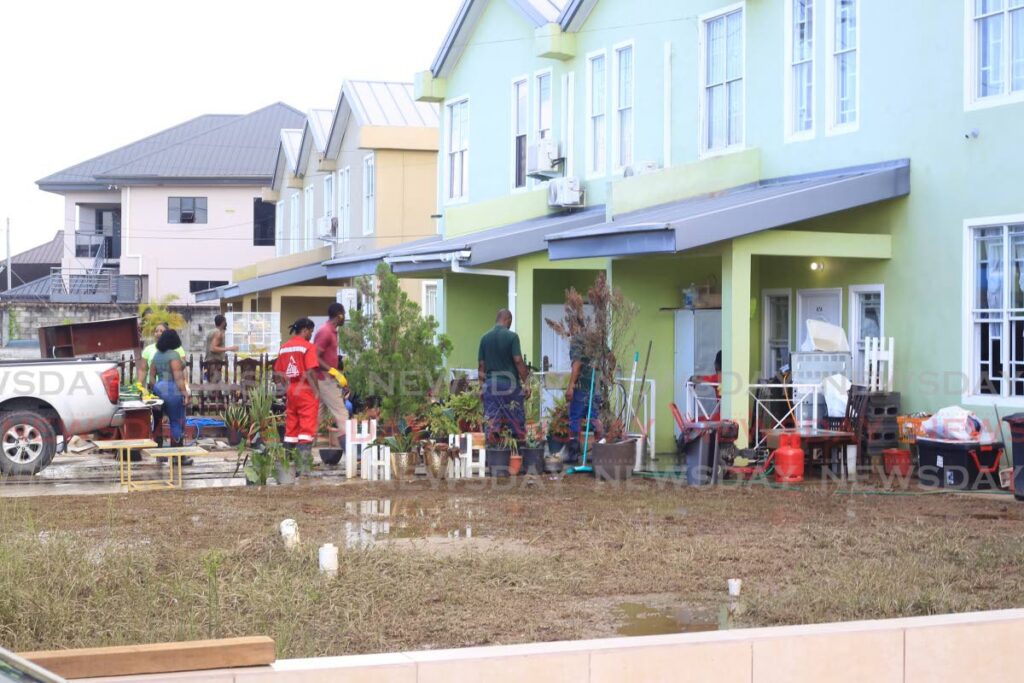 In this December 2022 file photo, members of the Defence Force, HDC Facilities Management and MTS were on hand to help residents of Real Springs, Valsayn South, with clean-up. Photo by Roger Jacob