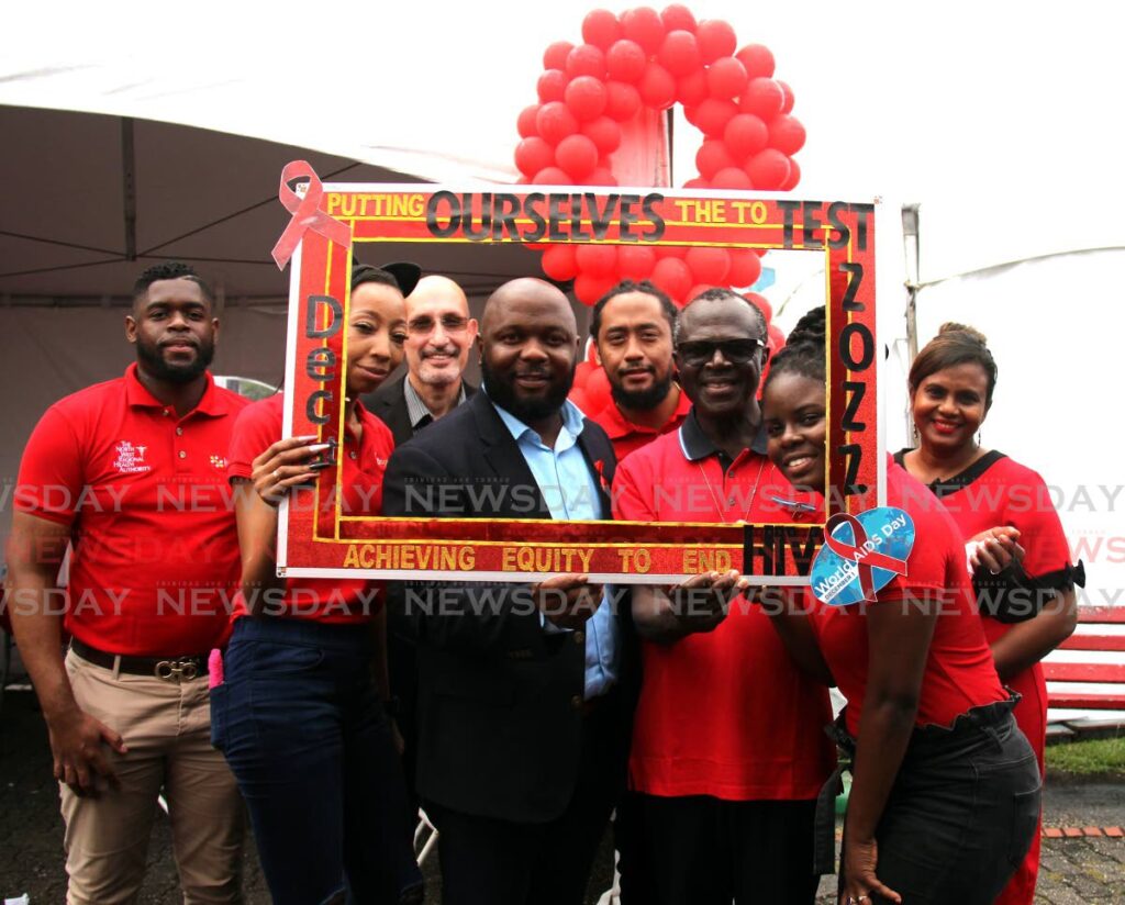 NWRHA acting CEO Anthony Blake, 3rd from left in photo frame, with members of the HIV/AIDS Co-ordinating Unit of the Ministry of Health at a fair along the Brian Lara Promenade in Port of Spain on Thursday. Photo by Ayanna Kinsale