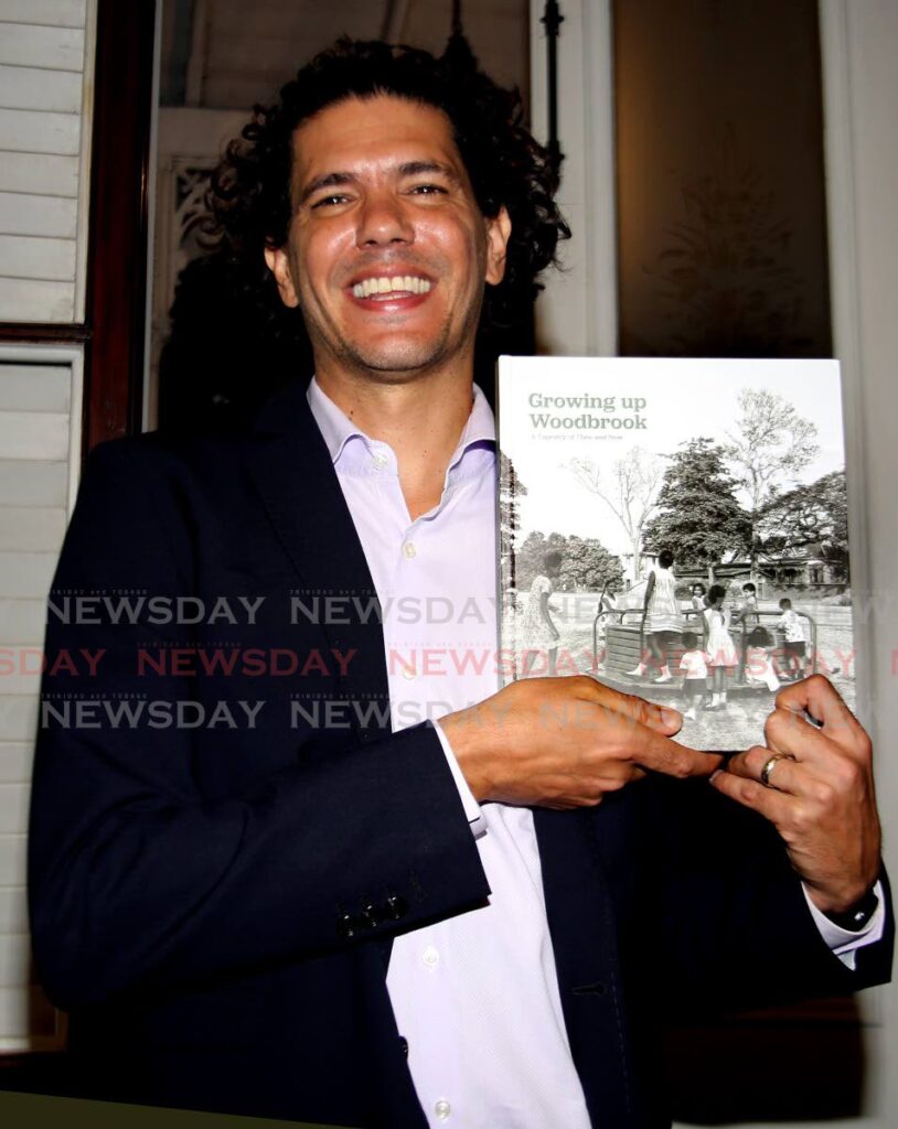 Dr Dylan Kerrigan with his book  Growing up in Woodbrook which was launched at  Mille Fleurs Heritage House, Queen’s Park West, Port of Spain, on Thursday. Photo by Sureash Cholai