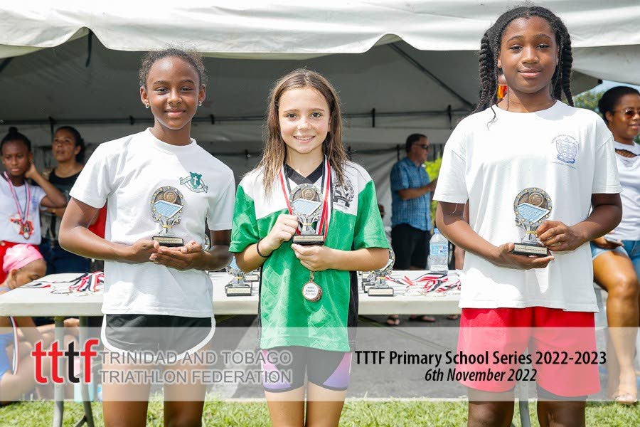 The top three finishers in the girls 12 and Under category. First-placed Leah De Freitas of Dunross, middle, second-placed Samantha Defreitas Manswell of Bishop Anstey Junior School, right, and third-placed Jodie-Marie Riley of St Monica’s. 