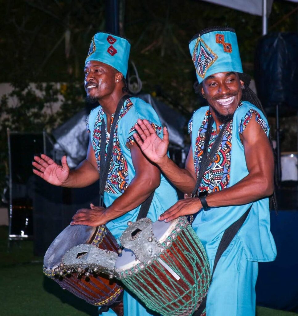 –wo drummers from Neptune’s School of Arts perform during the cultural performance segment of the International Organization for Migration Global Migration Film Festival held Saturday at Estate 101, Maraval. - 