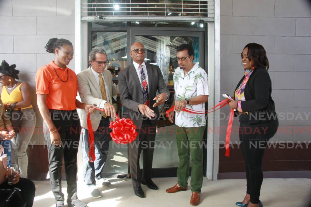 Managing Director of Mode Alive Gary Aboud cuts the ribbon with San Fernando Mayor Junia Regrello and Minister of Agriculture Land and Fisheries, Kazim Hosein to open the New Mode Alive location at Coconut Drive, Cross Crossing, San Fernando. - Photo by Lincoln Holder