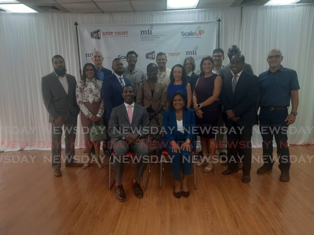 Seated front: UTC executive director Nigel Edwards and Trade and Industry Minister Paula Gopee-Scoon with the members of Cohort 2 of the Scale Up TT Programme. Photo by Paula Lindo