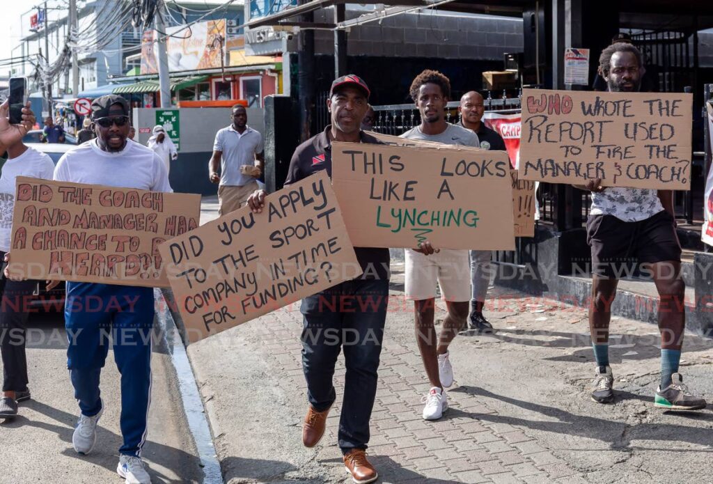 Assistant Secretary of Sport Wane Clarke, centre, leads a protest in Scarborough on Friday. Photo by David Reid