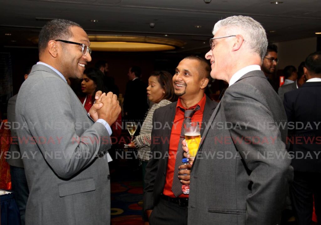 Atlantic manager Ronald Adams, team leader Rishi Mahadeo, and Energy Chamber Dr. Thackwray Driver speak during the launch of Champion X operations in Trinidad and Tobago at the Trinidad Hilton, Port of Spain.  2022.12.08 - Photo by Ayanna Kinsale
