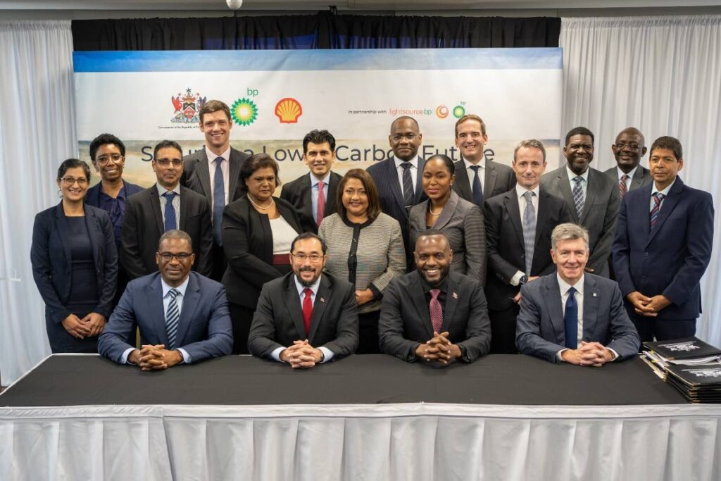 Euguene Okpere, seated from left, senior vice president and country chair, Shell TT, Energy Minister Stuart Young, Public Utilities Minister Marvin Gonzales and bpTT president David Campbell after the signing agreement for solar power facility at Queen's Park Oval, Port of Spain on Friday. Standing are representatives from Shell, bpTT, Lightsource bp, and the ministries of Energy and Public Utilities.  - 