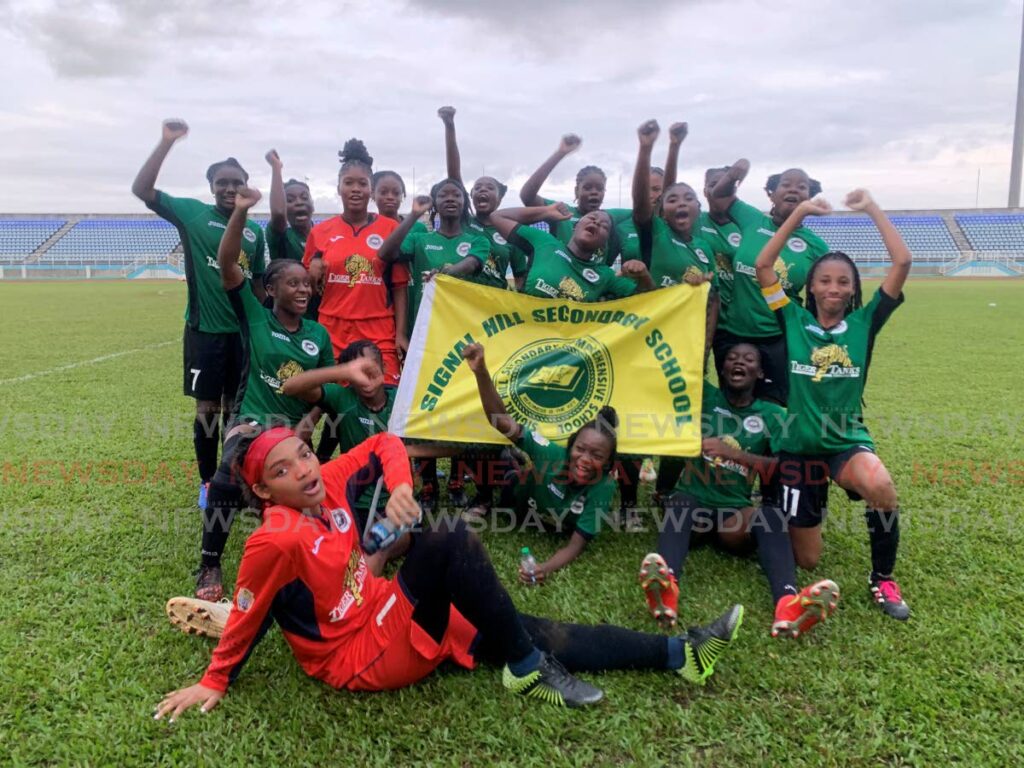 Signal Hill players celebrate after defeating Five Rivers Secondary 3-1 in the Coca-Cola Girls Intercol final, at Ato Boldon Stadium, Couva, on Sunday. - Marvin Hamilton