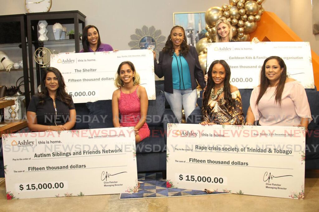 General manager of Ashley Home Store Jennifer Phillips, back row centre, CNC3 journalist Ria Rambally, front row left, fashion designer Jin Forde-Codrington, front row 2nd from right, and Samantha Conyers, back row right, with representatives from the four NGOs who received cheques on Sunday at the store's Chaguanas branch. PHOTO BY AYANNA KINSALE