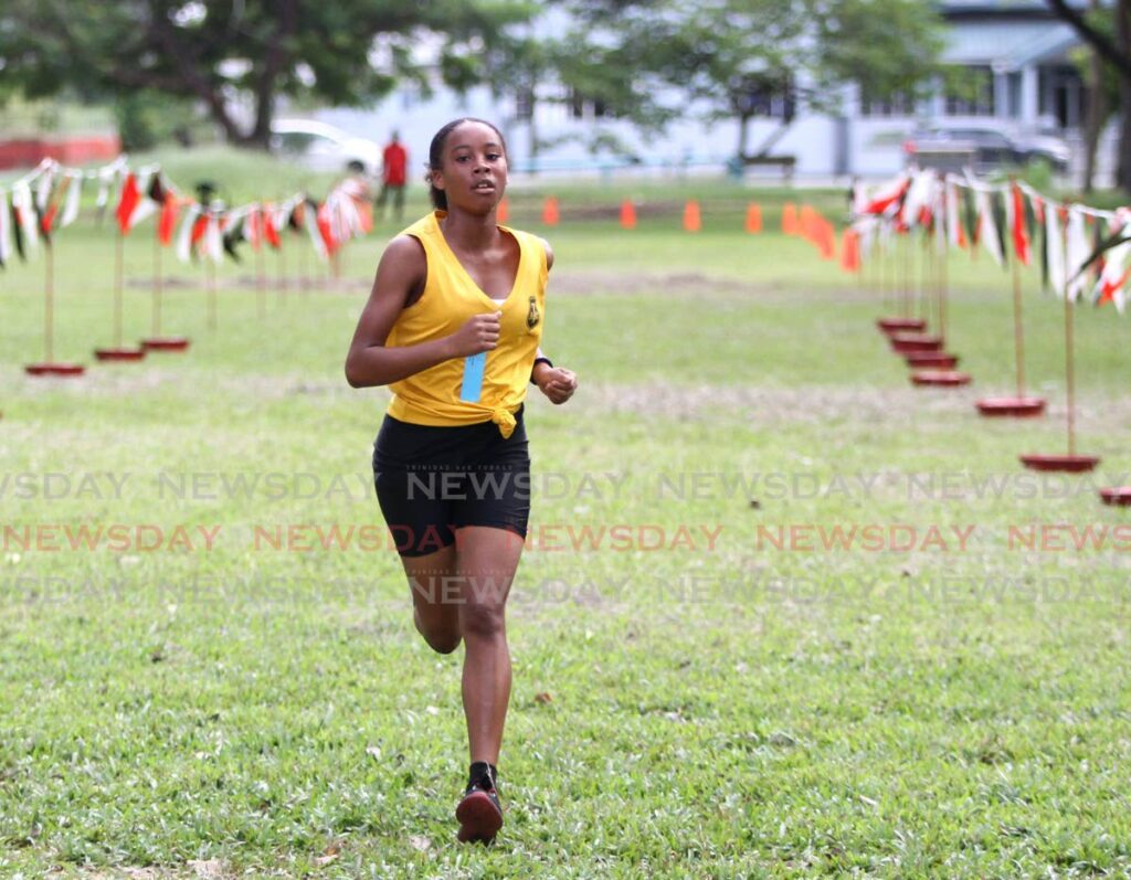 Tranquillity Secondary's Kelicia Aguillera finishes first in the Under-20 female category during the National Cross Country Championships at the Queen's Park Savannah, Port of Spain. Photo by Ayanna Kinsale
