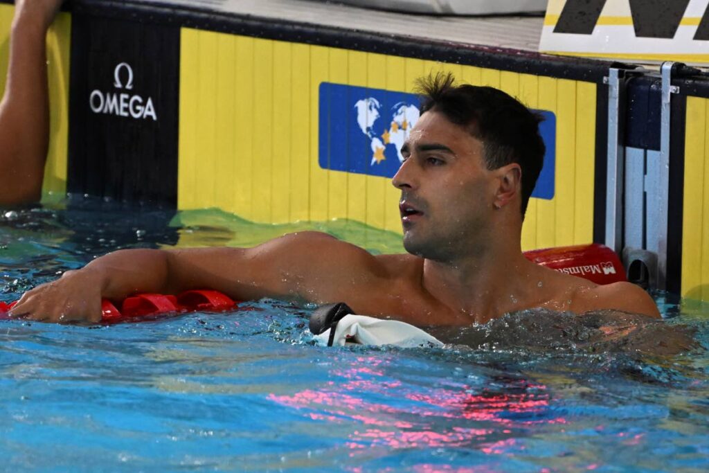 Dylan Carter of Trinidad and Tobago rests after winning his heat in the men's 50m butterfly during the world swimming short course championships in Melbourne, Australia, on Tuesday. (AP PHOTO) - 
