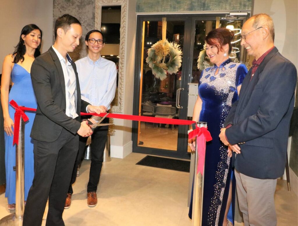 Managing director of Trader Jack's Restaurant, Ryan Achim cuts the ribbon to officially open the newly renovated establishment at Fiesta Plaza, MovieTowne,Invaders Bay,  as fellow directors and family members  Sarah Achim, left, Kevin Achim, Wendy Achim and Michael Achim look on. Photo courtesy Overtime Media