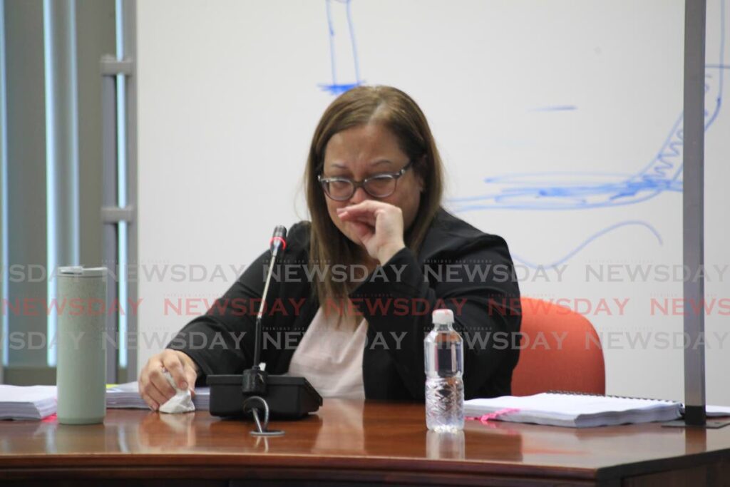 Catherine Balkissoon, Paria's technical lead, cries while giving evidence at the Commission of Enquiry into the deaths of four divers on February 25. - Photo by Roger Jacob