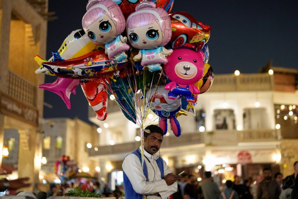 A street vendor sells balloons in Souq Waqif market in Doha, Qatar. AP Photo - 