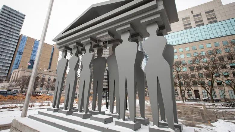 A sculpture depicting jurors stands outside the Ontario Superior Court of Justice courthouse in downtown Toronto. Image source: www.cbc.ca 
