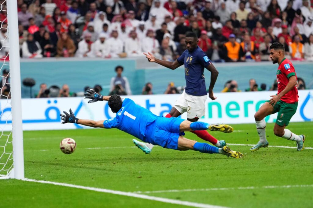 France's Randal Kolo Muani scores his side's second goal during the World Cup semifinal match between France and Morocco at the Al Bayt Stadium in Al Khor, Qatar, on Wednesday. (AP PHOTO)  